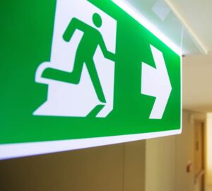 Emergency-Fire-exit-sign-at-the-corridor-in-building